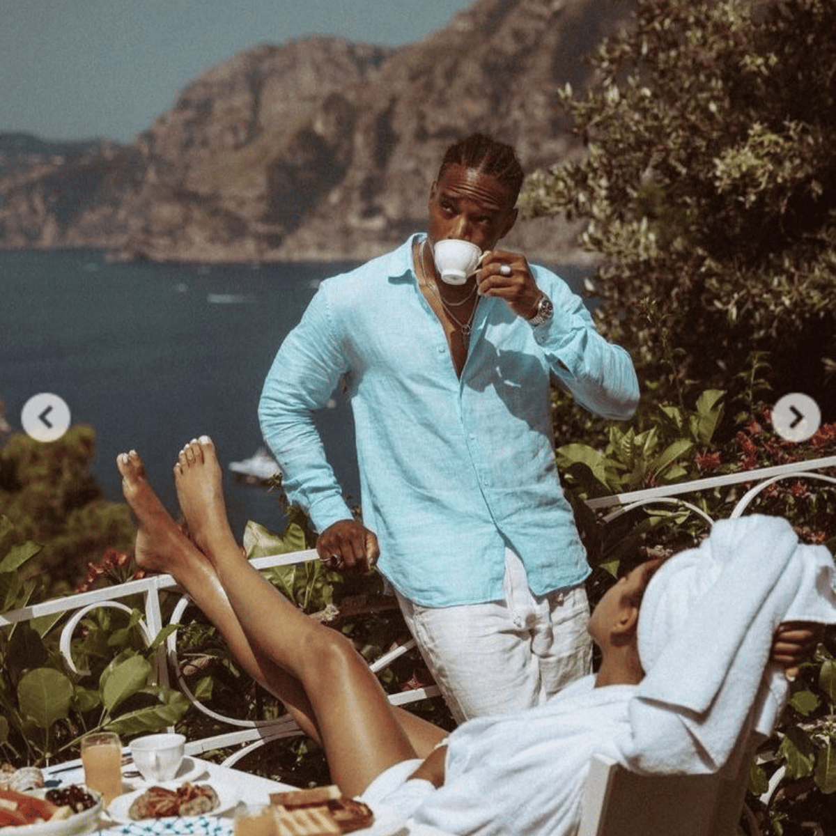 Man in light blue shirt drinking coffee with a scenic background.Discover Belle Exotics, your destination for luxury adult toys and wellness products. Shop discreetly in Trinidad and Tobago with fast, private delivery. Elevate intimacy today.