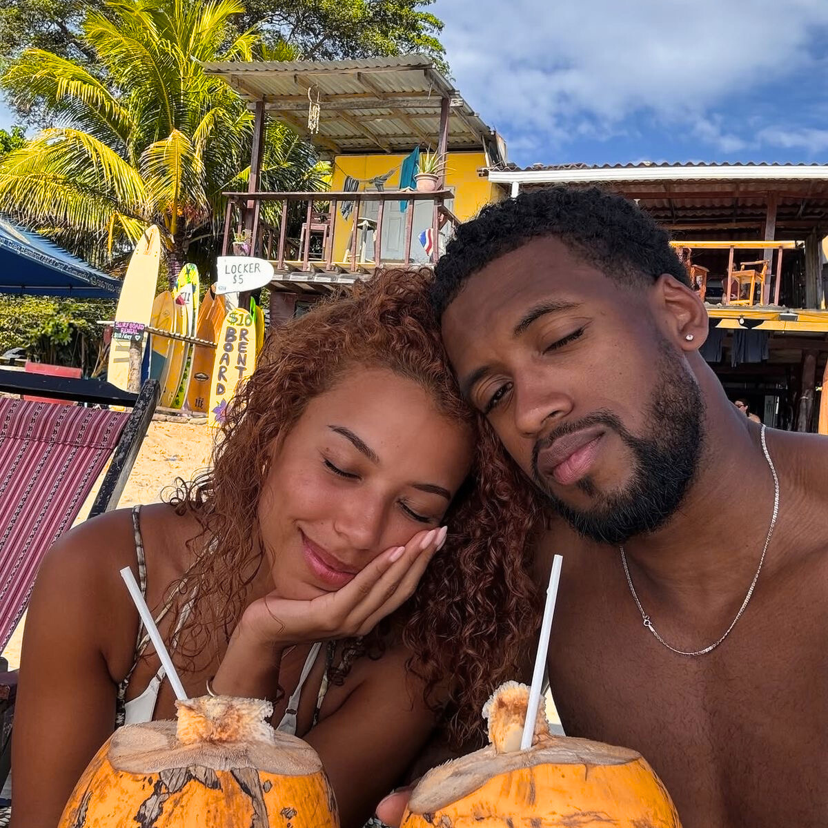 Couple enjoying coconuts with a tropical setting.Your Golden Hour campaign by Belle Exotics in Trinidad and Tobago promoting confident exploration, sexual wellness, and guided intimacy in-store and online.