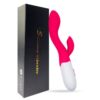 Pink and white silicone vibrator with packaging on a white backgroundRIDING SOLO RABBIT VIBRATOR - ROSE- BELLE EXOTICS-TRINIDAD AND TOBAGO-Discover Pleasure and Style with Belle Exotics Vibrator Collection - Empowering Intimacy in Trinidad and Tobago, Jamaica, Barbados, Guyana, Bahamas, USA, and Canada